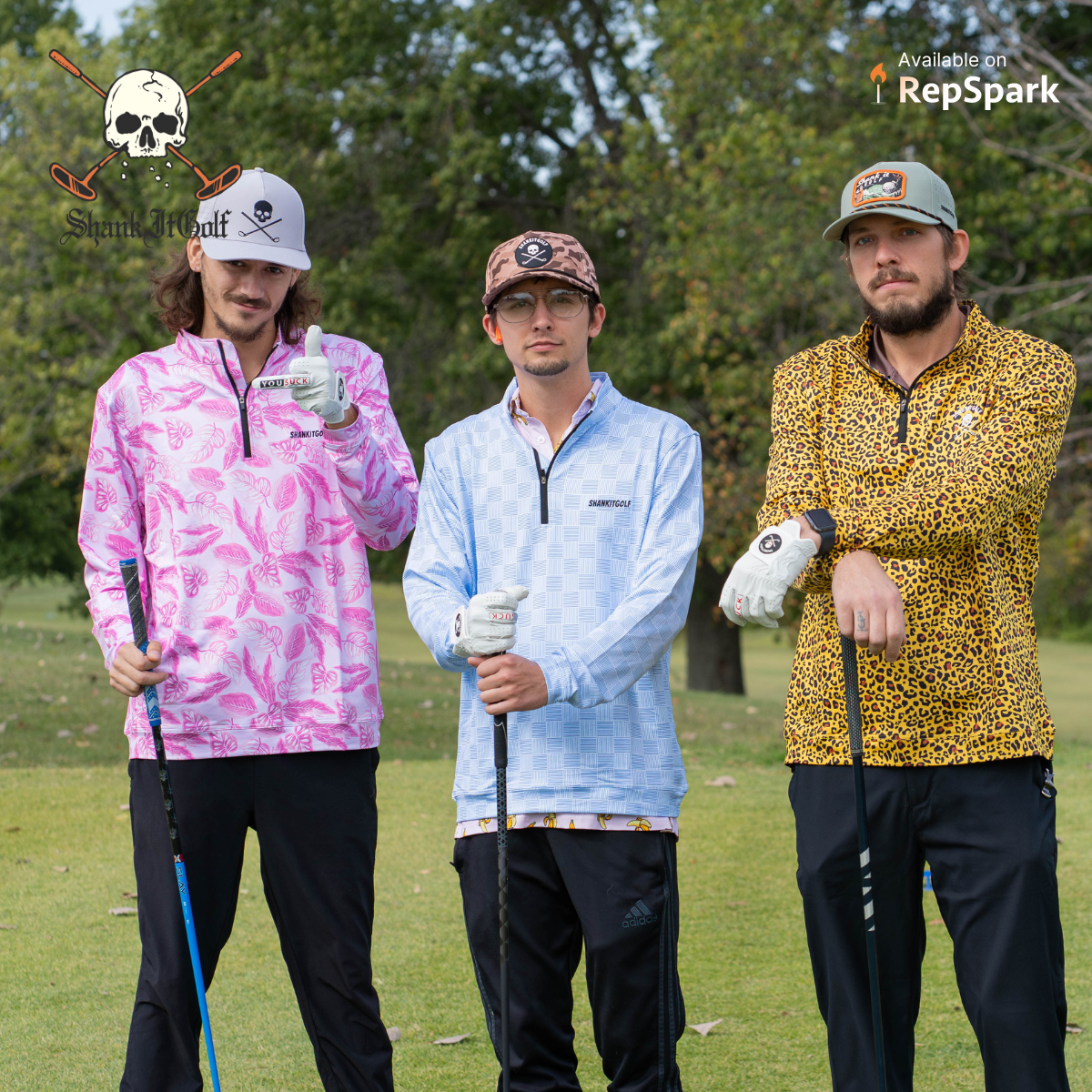 3 male golfers wearing vibrant polos standing with golf clubs in their hands on a golf course.