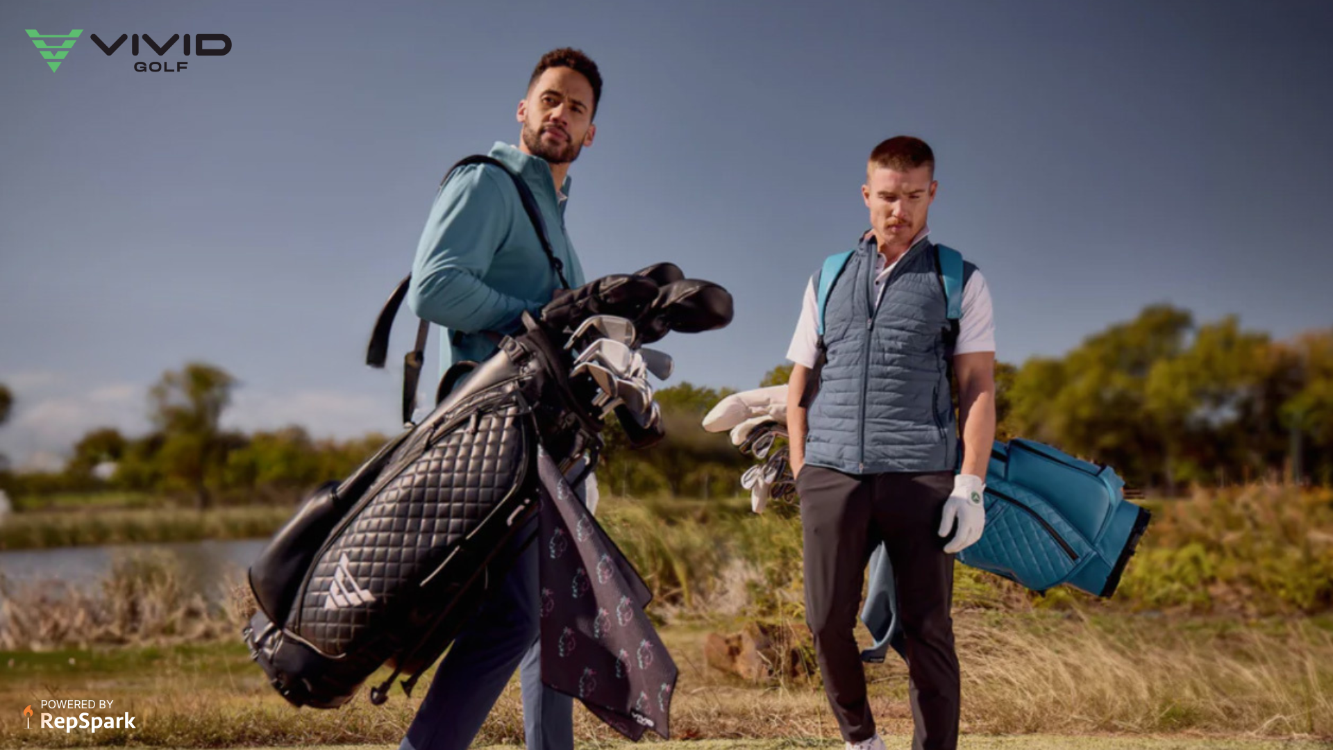 Two men wearing golf clothing and golf gear posing on a golf course.