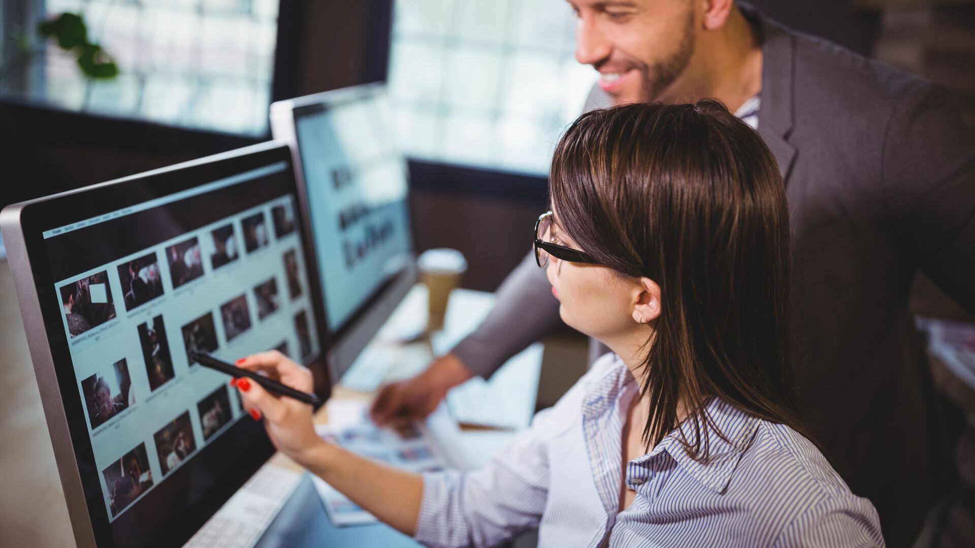 man and women reviewing digital files on a computer screen in a thumbnail for a RepSpark blog